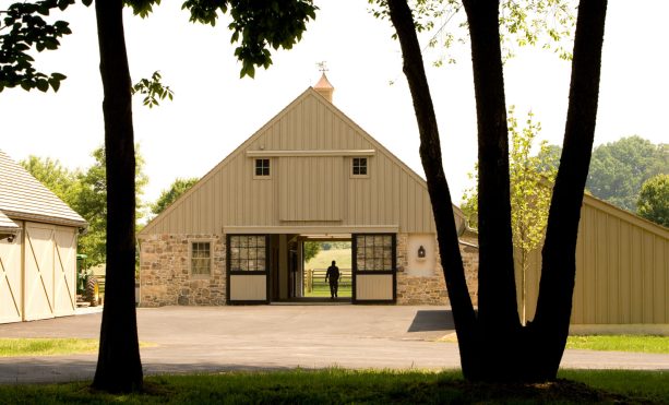 dark colored barn doors with beige panels and windows