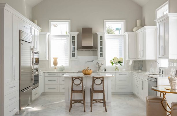 mediterranean kitchen with white cabinets and greige Sherwin Williams SW 7647 Crushed Ice wall paint color