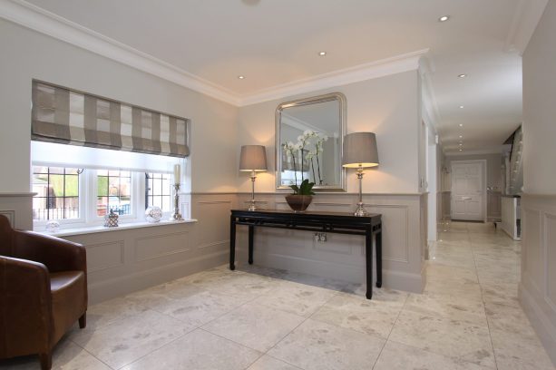 hall with grey flat panel wainscoting