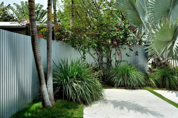 the use of corrugated metal for backyard fence