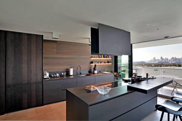 black contemporary kitchen cabinets with dark wood backsplash