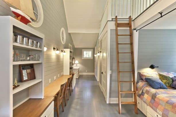 beach-style kids room with grey paneled wall and custom-stained white oak