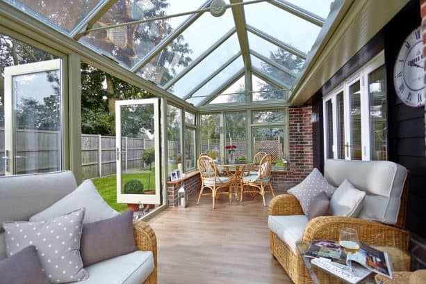 a sun room addition with an elegant sage green color