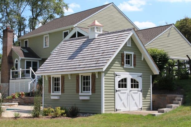 the coordinating taupe exterior between the colonial garden shed and the main house