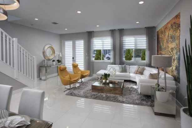 contemporary living room with abstract pattern of gold yellow paint and dark gray wall