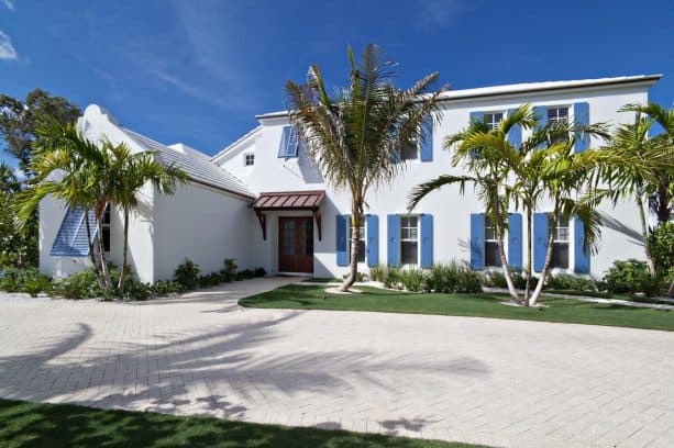 white two-story house remodel feat. blue shutter