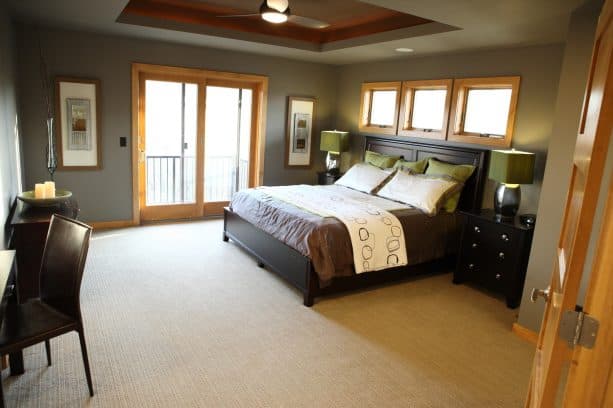 benjamin moore taos taupe paint color with honey oak trim in a modern bedroom