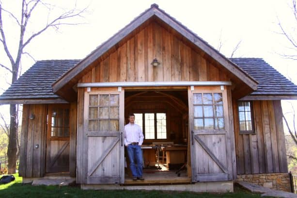 double sliding barn doors made of weathered wood with windows