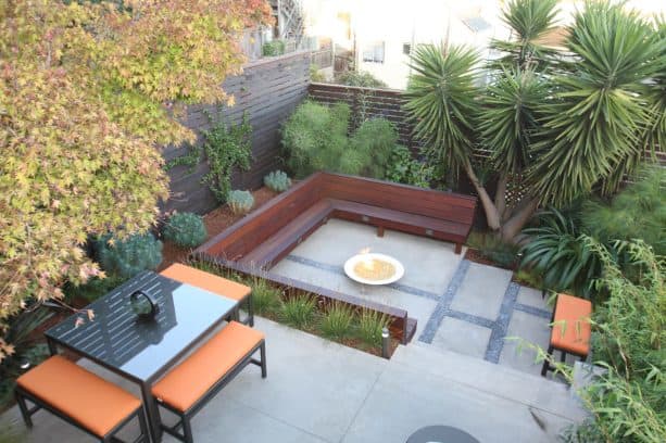 small modern backyard landscaping with multilevel corner fences