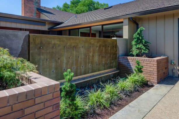 concrete fountain patio wall with water pegs