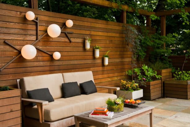 wood panel patio wall with decorative lights