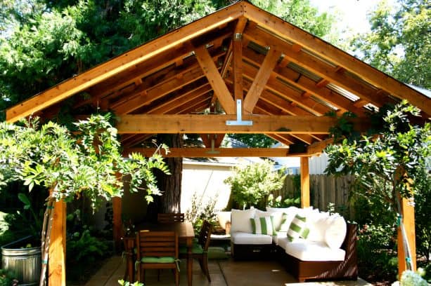 a waterproof corrugated metal roof cover serves a multi-use patio