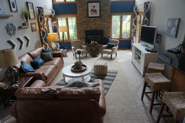 two accent walls that marry nautical blue and the natural charm of the stone