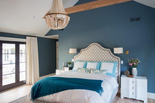 a bedroom with teal and white theme