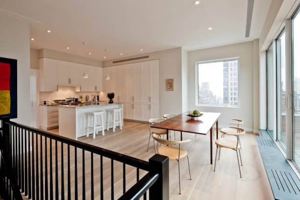 open contemporary dining room with silvery grey walls and matte-finished white oak wood floor