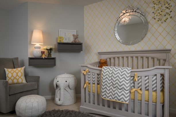 gray and yellow themed nursery wall decor with floating shelves