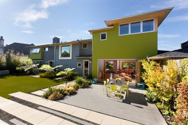 white trim for a pear green and grey stucco contemporary exterior