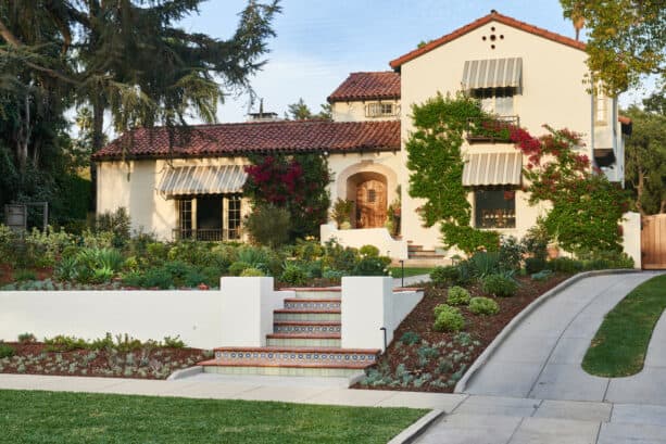 tuscan low-maintenance hillside landscaping with sloped garden