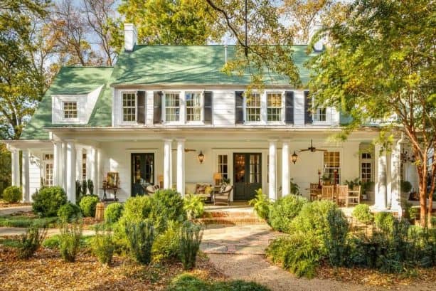 murky shutters are the best match for a white house with beautiful green roofs