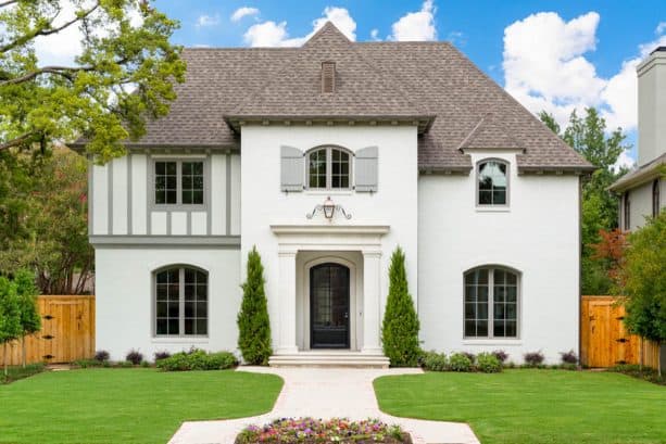 small gray shutters look cute on a white house’s exterior