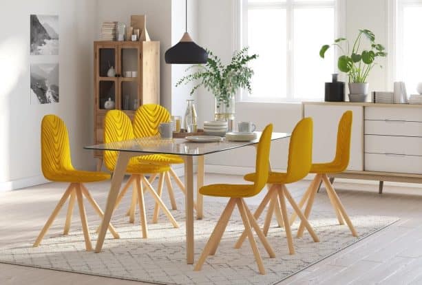 a white area rug defining a dining space in an open-floor interior