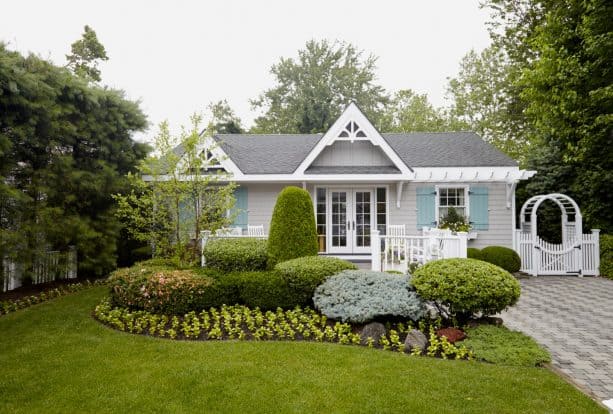 benjamin moore’s azure water shutters complement white wall and windows perfectly