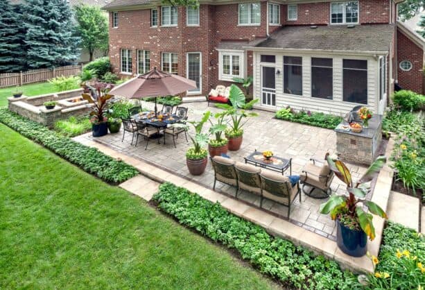 an evergreen ground cover is used as a patio border