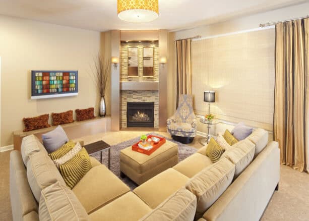 gold frame around the corner fireplace as an accent wall