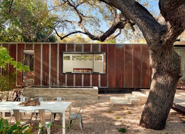 metal building with rustic style completed with a modern two-panel window