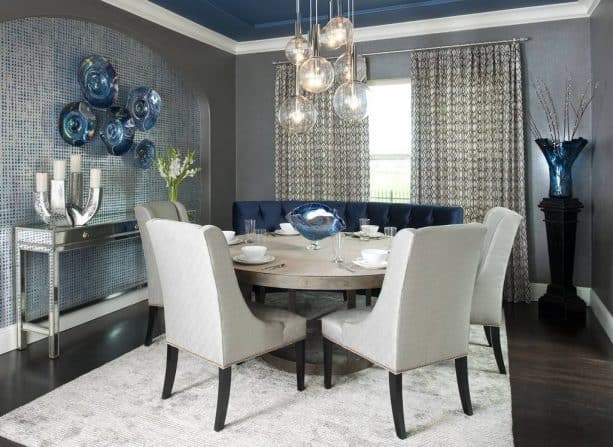 a dining room with light grey and navy theme