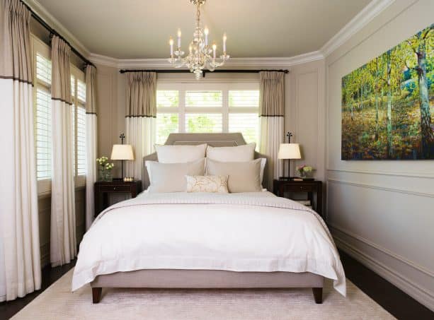 transitional bedroom with warm grey walls and dark wood floor