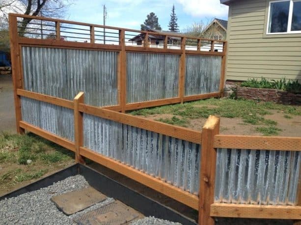 short wood-framed corrugated metal fence