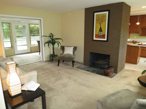 simple living room with brown brick fireplace