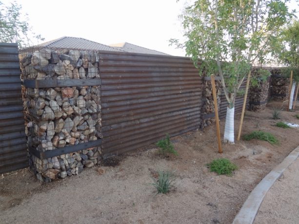 corrugated metal and gabion wall combination for fencing