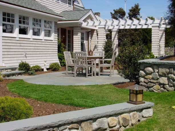 small patio in a front yard with a traditional style