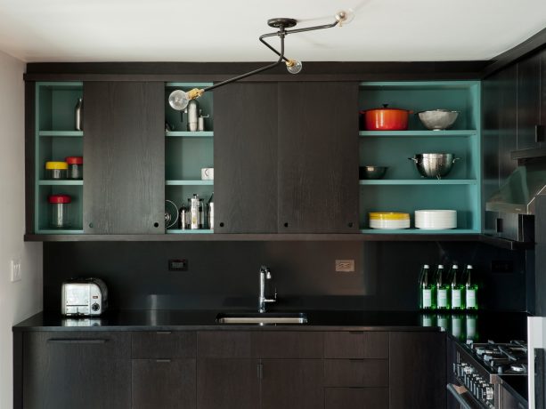 Flat-Panel Kitchen Cabinets with a Black Sliding Door