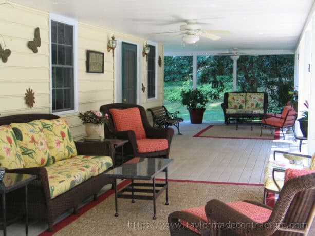 combination of wicker and wrought iron seating in a timeless porch