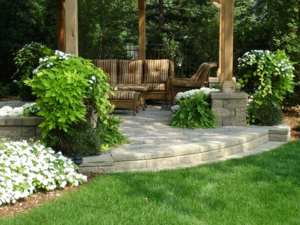 raised patio completed with a pergola for a secluded outdoor place