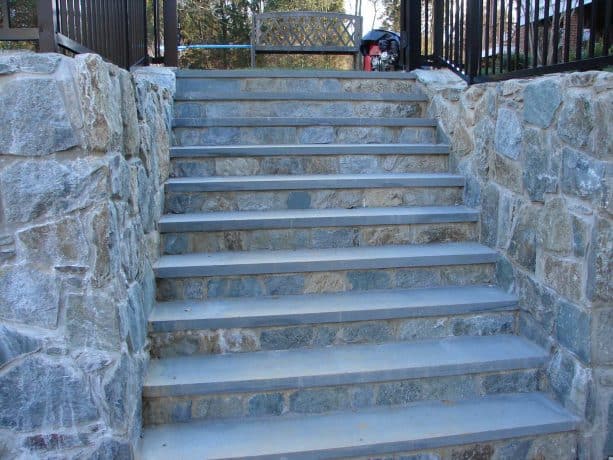 create a cohesive look by using stone veneer on the risers on your stairs