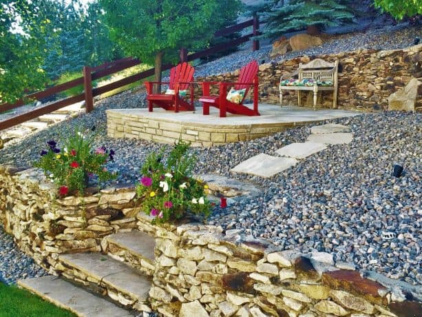 siloam rock rip rap retaining walls create level areas on a sloped property