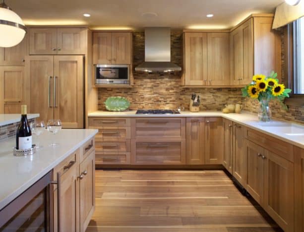 creamy white quartz countertops combined with medium tone oak cabinets