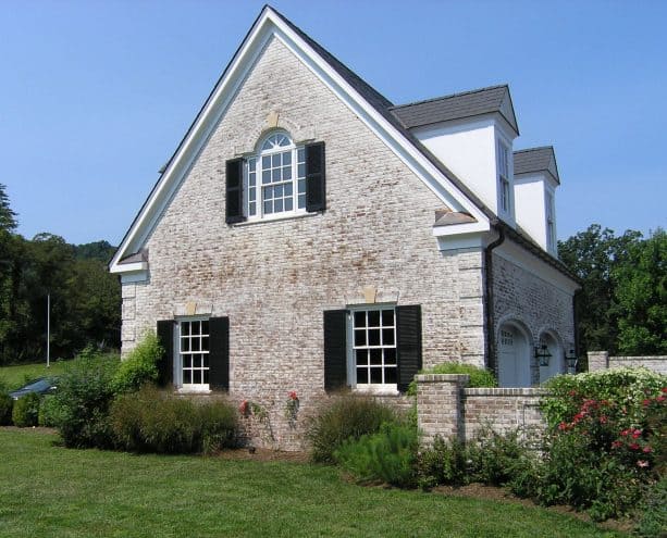 exterior with lime-washed brick wall