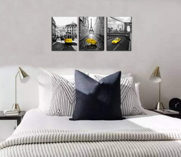 yellow and gray-themed panel wall art in a modern bedroom