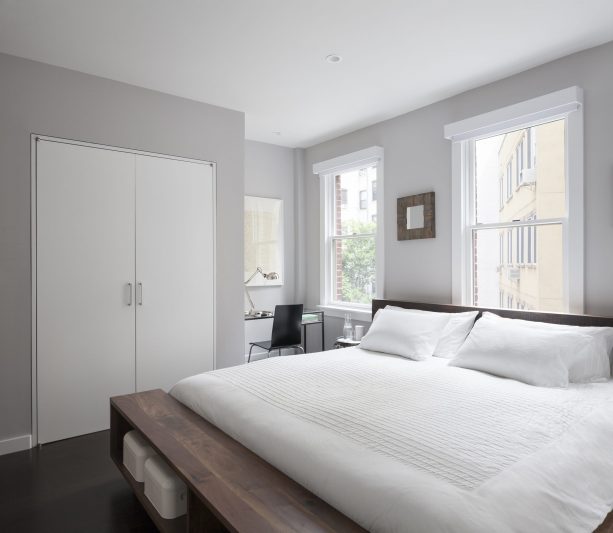 dreamy and cozy modern bedroom with grey wall and dark engineered African mahogany floor