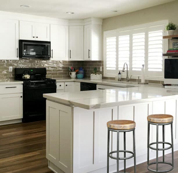 sunburst shutters for double kitchen windows over the sink