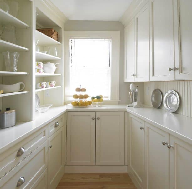 a cozy kitchen design with vertical stripes warm white wood backsplash and cabinets