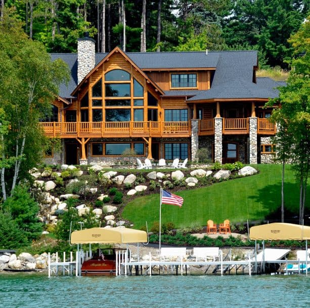 an asphalt shingle roof in slate black color for a three-story log cabin