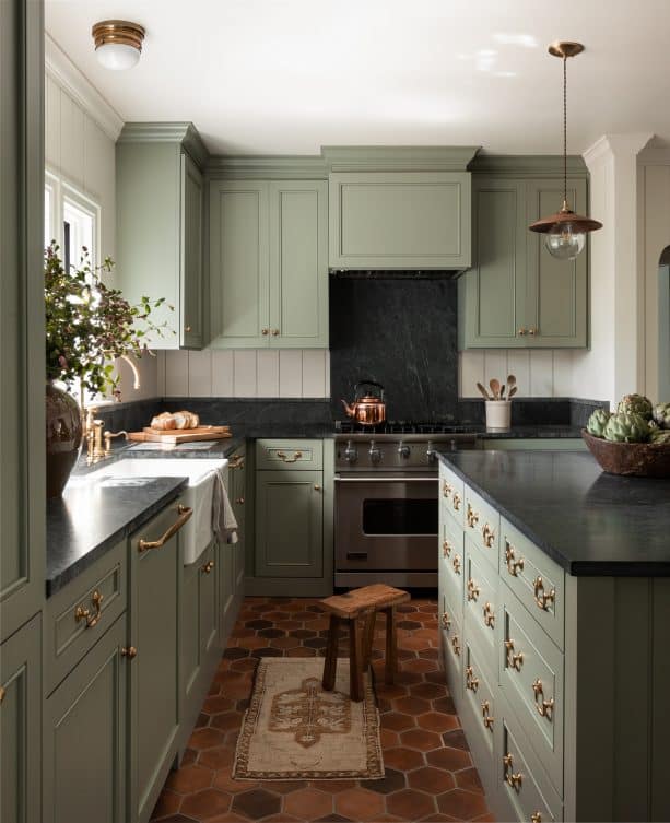 a kitchen interior with sage green and white color scheme