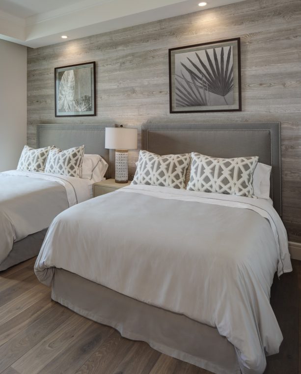 beach-style bedroom with warm grey wall and engineered white oak flooring