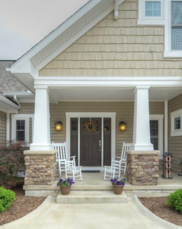 stone pillars to accentuate the concrete front porch idea